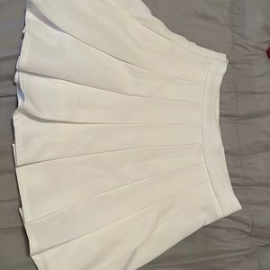 White tennis skirt from SHEIN. The size is a petite Medium.
